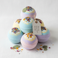 Colorful homemade vegan bath bombs with dried flowers and botanicals